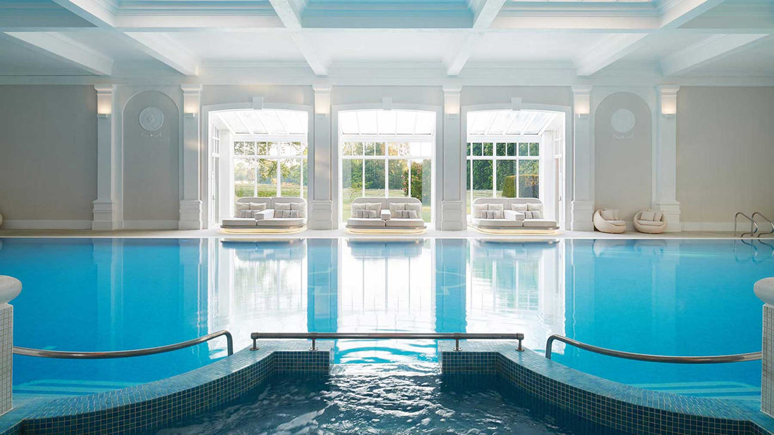 empty blue indoor swimming pool at a spa 